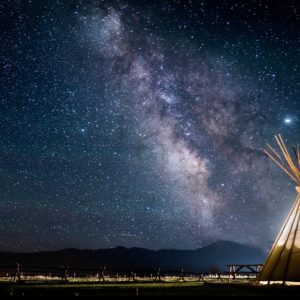 photo of teepee under a starry sky